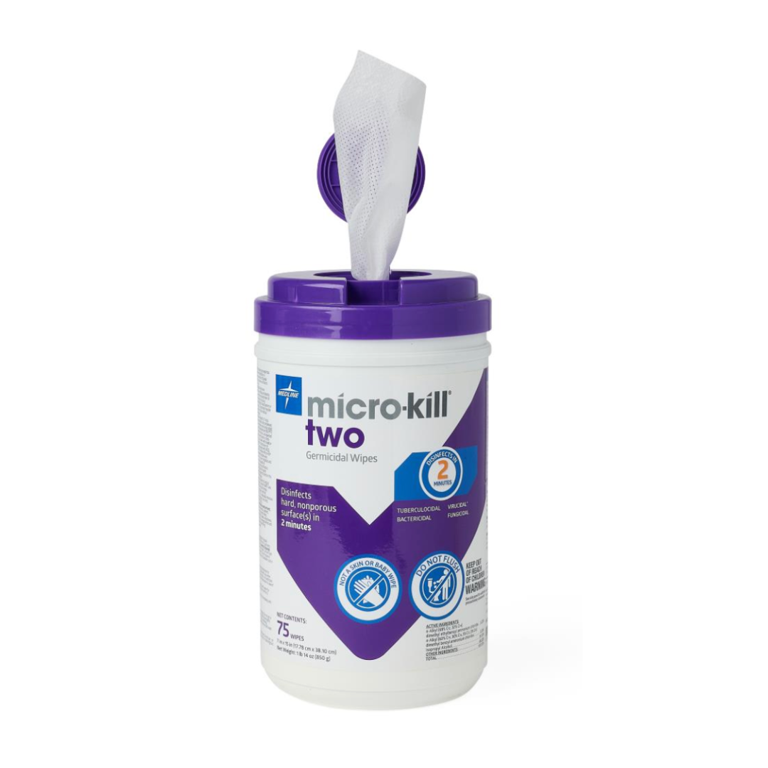 A white container of Micro-Kill Two Disinfectant Wipes with a purple lid has one wipe partially pulled out and visible product labels. These wipes kill viruses effectively on hard surfaces.